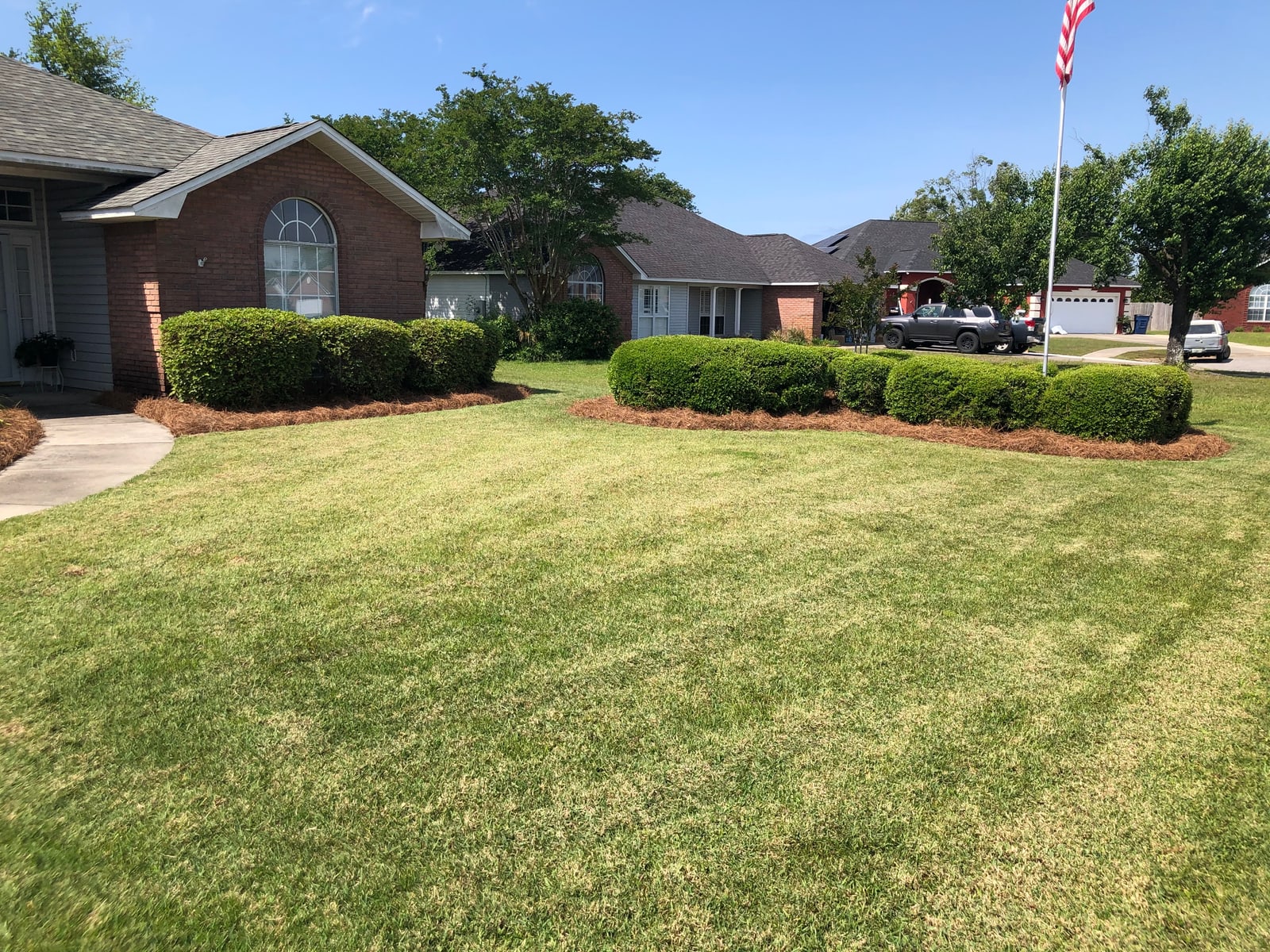 Healthy green lawn mowed and trimmed front to back